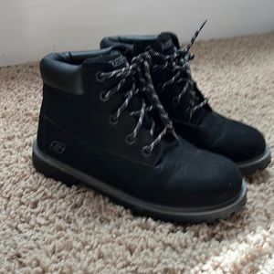 Boy black Skechers boots